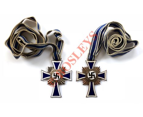 German Third Reich Mother’s Cross 2nd Class and a 3rd Class. The first a good silvered example with blue and white enamelled 