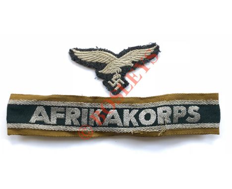 German Third Reich WW2 Afrika Korps cuff title. A good used example, remaining stitched.  Tan cotton band with silver wire bl