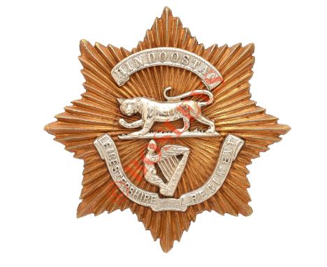 Leicestershire Regiment Victorian Officer’s forage cap badge. A good die-stamped gilt star mounted with silver ‘Hindoostan’ s