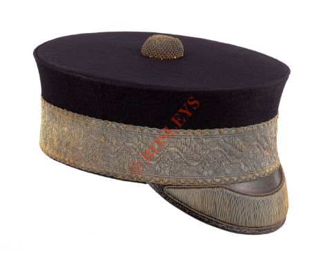Victorian General’s Peaked Forage Cap. A good and rare example. The body of dark blue Melton cloth, mounted with a band of go