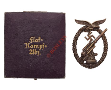 German Third Reich WW2 Luftwaffe Flak breast badge in case of issue. A fine die-cast oxidised silver example.  Within an oval