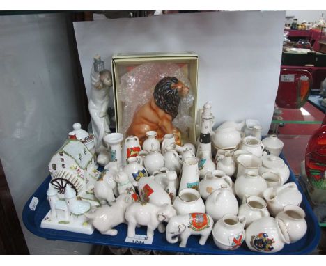 Wade 'The British Lion', boxed, Nao figure, Coalport cottages, a large collection of crested vessels, elephants, etc:- One Tr