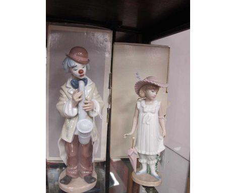 Lladro 'Sad Sax' Figurine, 22cm high, boxed Nao girl with parasol (both boxed) (2).