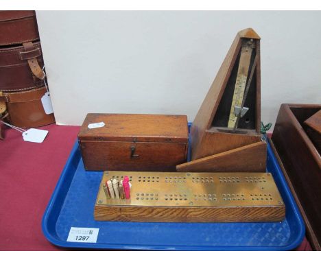 Maelzel Metronome. Twenty-eight bone dominoes in a wooden box, brass topped crib board (3)