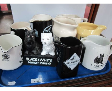 Advertising Water Jugs, Black and White Scotch Whisky, White Horse water jug, Teachers Scotch Whisky jug:- One Tray.