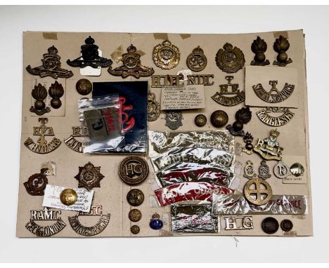 Territorial / RFA and Home Guard. A display card containing cap badges, collar dogs, shoulder titles and buttons. Noted: Roya