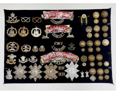 38th - 42nd Foot Regiments. A display card containing cap badges, collar dogs, shoulder titles and buttons. Noted: South Staf