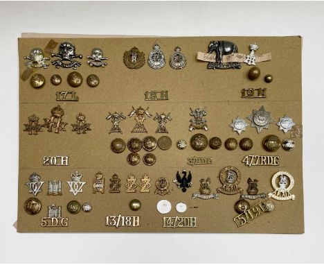 17th Lancers to 15th/19th Hussars. A display card containing cap badges, collar dogs, shoulder titles and buttons. Noted: 13t