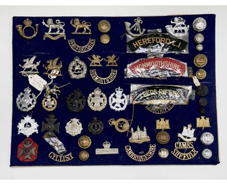 Territorial Army County Regiments. A display card containing cap badges, collar dogs, shoulder titles and buttons. Noted: Lee