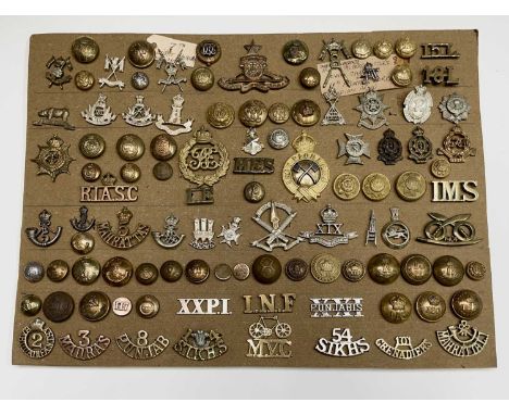 Indian Army. A display card containing cap badges, collar dogs, shoulder titles and buttons. An interesting lot. Includes: 10