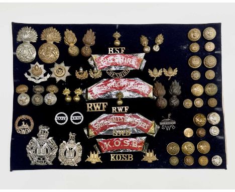 English, Scottish and Welsh Regiments - 21st-25th Foot. A display card containing cap badges, collar dogs, shoulder titles an