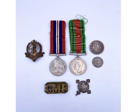 Medals, badges &amp; coins Lots comprises a World War 2 Defence Medal &amp; War Medal, a "CMP" shoulder title, a silver St Jo