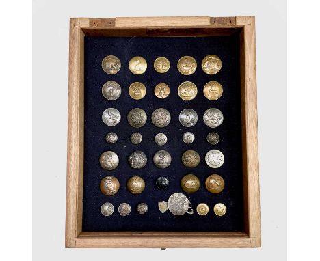 Livery Buttons (x36). Comprising a board mounted framed and glazed display of 36 brass and plated family livery buttons.

Con