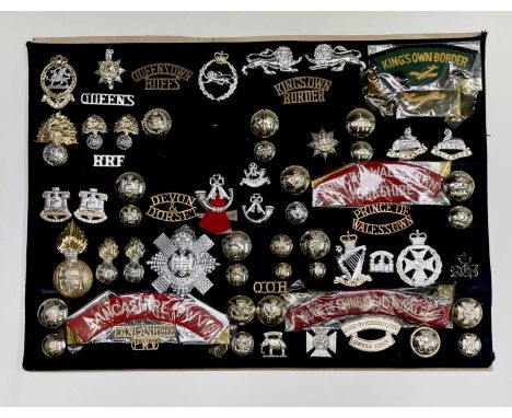 1960's Amalgamated Regiments. A display card containing cap badges, collar dogs, shoulder titles and buttons. Noted: Lancashi