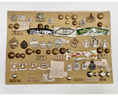 Lancers, Queens Dragoon Guards, etc. A display card containing cap badges, collar dogs, shoulder titles and buttons. Noted: 1