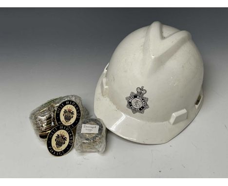West Midlands Police Hard Hat. Plus 33 enamelled West Midlands Police warrant card badges.

Condition: please request a condi