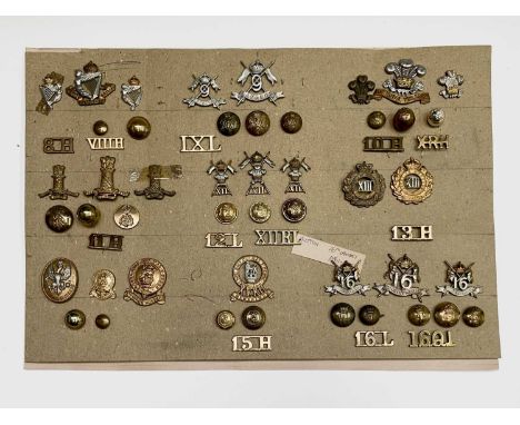 8th Hussars to 16th Lancers. A display card containing cap badges, collar dogs, shoulder titles and buttons. Noted: 8th Kings