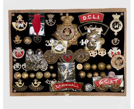 Cornwall Regiments: Duke of Cornwall Light Infantry, etc. Comprising a board mounted framed and glazed display of badges, col