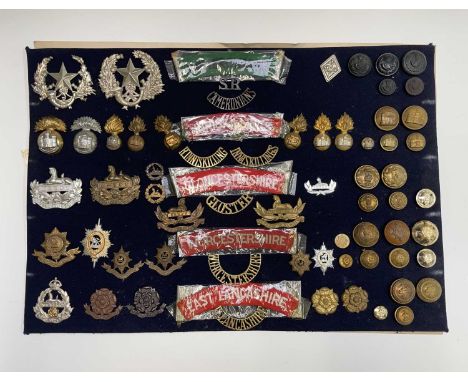 English and Scottish Regiments - 26th-30th Foot. A display card containing cap badges, collar dogs, shoulder titles and butto