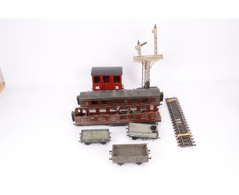 A Mixed Assortment of 0 Gauge Trains and Accessories, including Marklin 20v electric locomotive No. 910 in green, missing a d