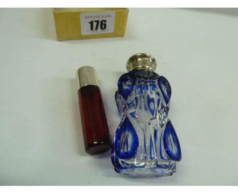 Ruby glass cylindrical scent bottle with silver screw cap - Sampson Mordan - London 1885 and a glass blue overlay scent bottl