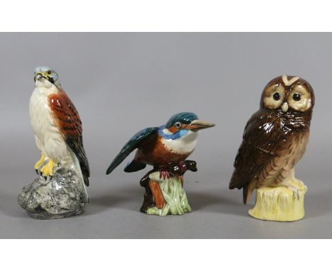 A Beswick model of a kingfisher, a Beswick model of a kestrel advertising 'Beneagles Scotch Whisky' along with one similar by