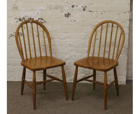 A pair of beech Ercol style dining chairs.