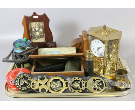 A tray of collectables to include Kundo anniversary clock, horse brasses, oak bookends, dominoes for the blind, carved pictur