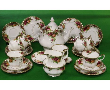 A Royal Albert six place tea service decorated in The Old Country Roses pattern along with a matching tea and biscuit plate a