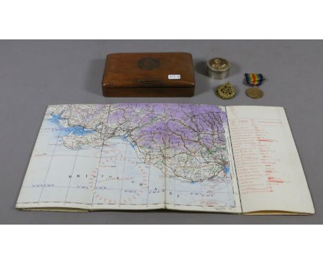 A mahogany box and contents of World War I medals, RAF cap badge, French trinket box and a Royal Air Force map of England and