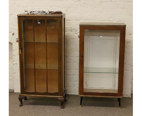 A light oak single door china cabinet along with a 1970s single door china cabinet.