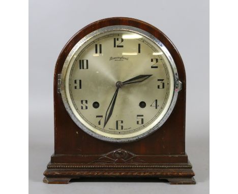 A Bravingtons mahogany cased eight day dome topped mantel clock chiming half-hourly on a gong.