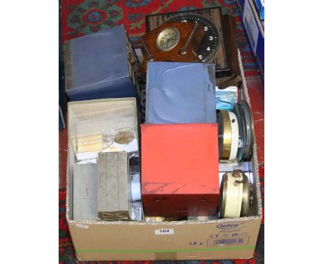 A large collection of watch and clock spares, replacement glass, balance wheels, etc.