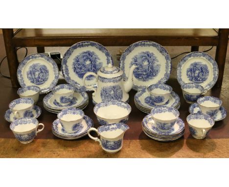 A twelve piece china tea service printed in blue with rural scenes.