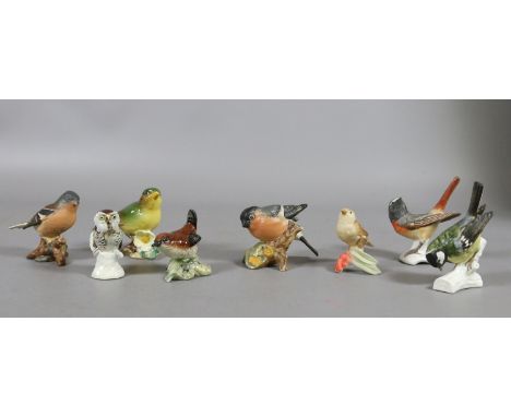 Four ceramic models of Beswick birds and four similar Goebel models.