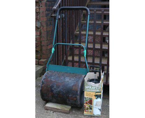 A steel garden roller and a Ronseal wood treatment pressure sprayer.