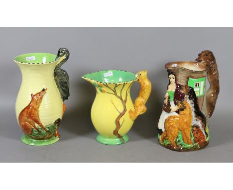 Three Burleigh ware pottery jugs to include Old Feeding Time, The Fox and Heron Fable and a squirrel handle example.