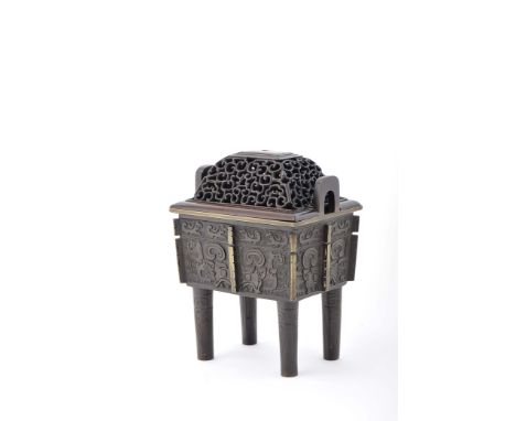 A censer, patinated bronze, decoration en relief, pierced tamarind cover, Chinese, 19th C., missing cover pommel, minor fault