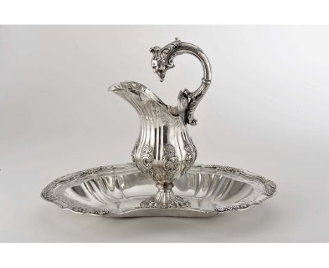 A basin and ewer with open handle, D. José I, King of Portugal (1750-1777), engraved decoration en relief "Leaves and shells"