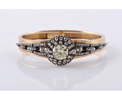 A rigid bracelet, 750/1000 gold and 950/1000 silver, set with rose cut diamonds, 2 antique brilliant cut diamonds with the ap