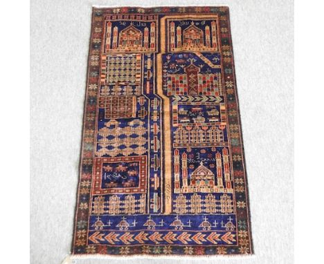 An oriental carpet, with geometric designs, on a blue ground, 138 x 83cm 