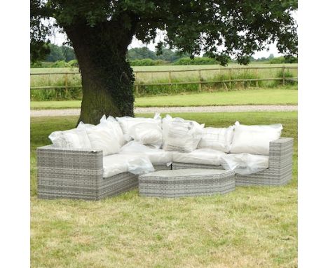 A rattan style garden corner sofa, 250 x 250cm, together with a matching coffee table