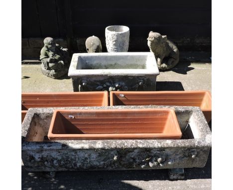 A reconstituted stone planter, 90cm, together with another smaller, three rectangular terracotta planters, a reconstituted st