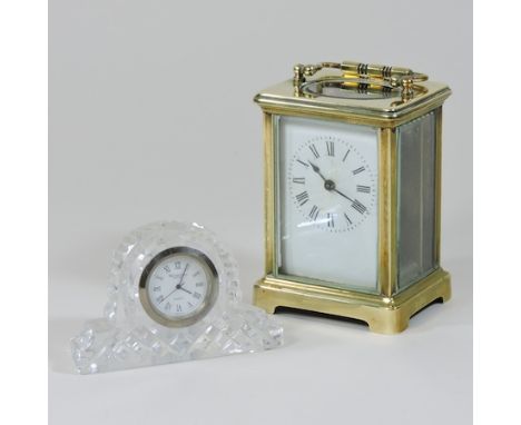 A brass cased carriage clock, together with a Waterford clock, 6.5cm high