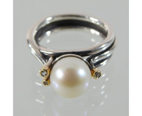 A 14 carat gold silver, pearl and diamond ring, boxed