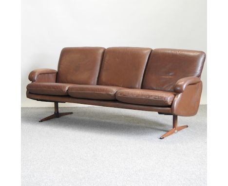 A 1970's brown leather upholstered sofa, 192cm