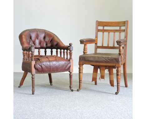 A Victorian red upholstered library chair, together with an Edwardian oak armchair and an Ercol elm dining chair