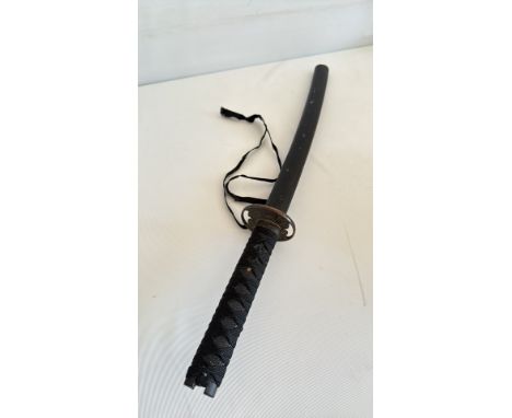Japanese-style katana with black braided handle, ornate tsuba, and matching black scabbard.