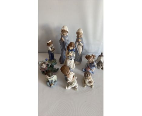 Nao porcelain figurine, white with blue accents, depicting a child with a book. Collection of 10 Nao figurines, various child