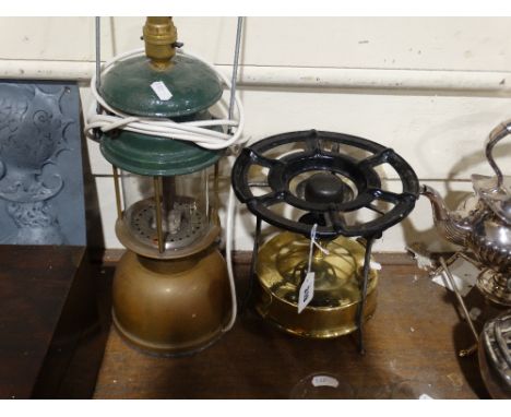     A Circular Brass Burner, Together With A Converted Storm Lamp                   